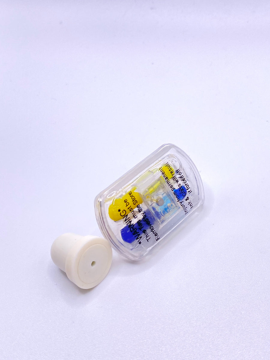 clear ink pin with yellow and blue dye, external warning label with EAS clutch pin